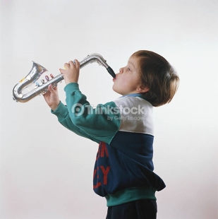 boy-playing-trumpet-side-view-picture-id200325090-001